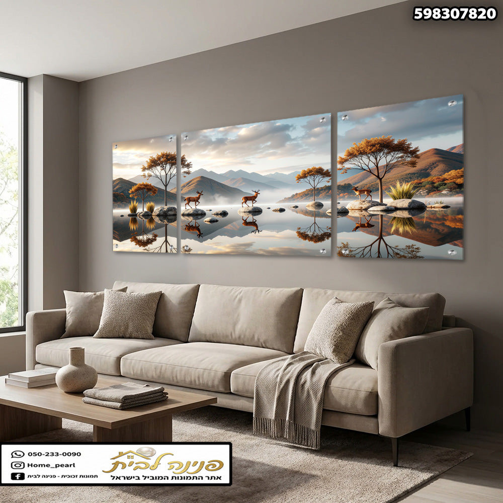 תמונת נוף רגוע של איילים, עצים והרים מעל אגם משתקף בסלון - תמונות קיר