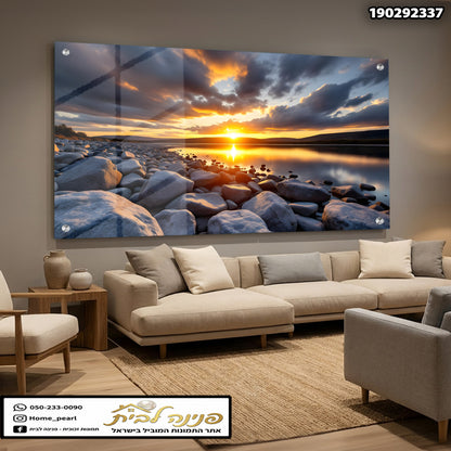 תמונה של שקיעה עם אבנים ליד המים - תמונות לסלון - צבעים כחול, אפור וכתום